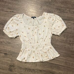 Peplum top with flower design